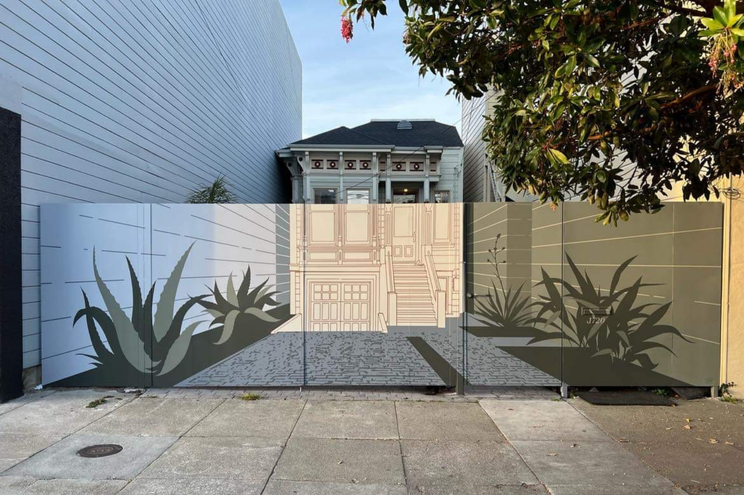 portail d'une maison peint en trompe-l'œil comme si on voyait ce qu'il y a derrière : des cactus et la maison.